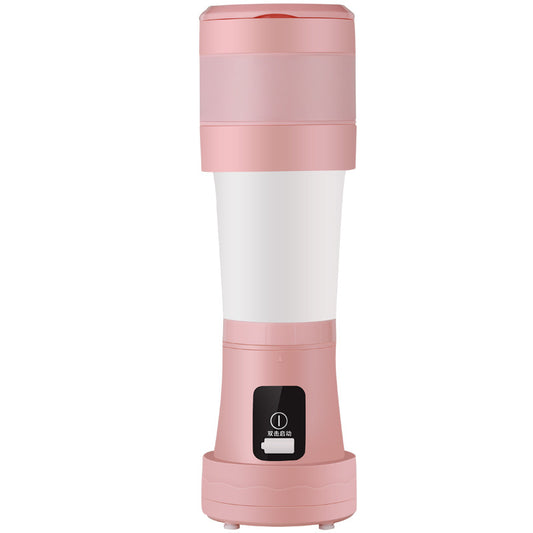 Pink and white portable juicer on a white background
